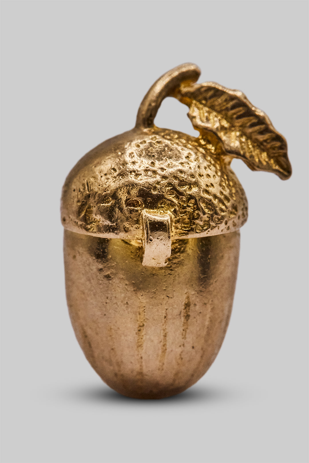 The Mischievous Golden Squirrel in an Acorn Opening Charm (9ct 375 Gold 1967)