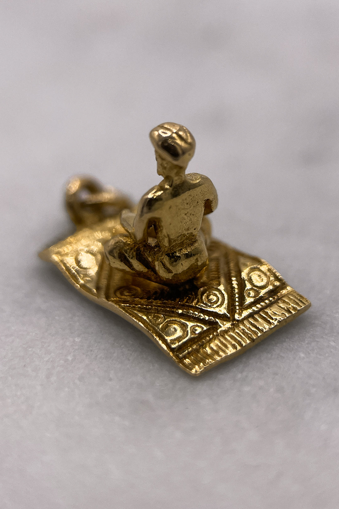 The Fairytale Aladdin on the Magical Carpet Charm (375 9ct gold, made in 1958)