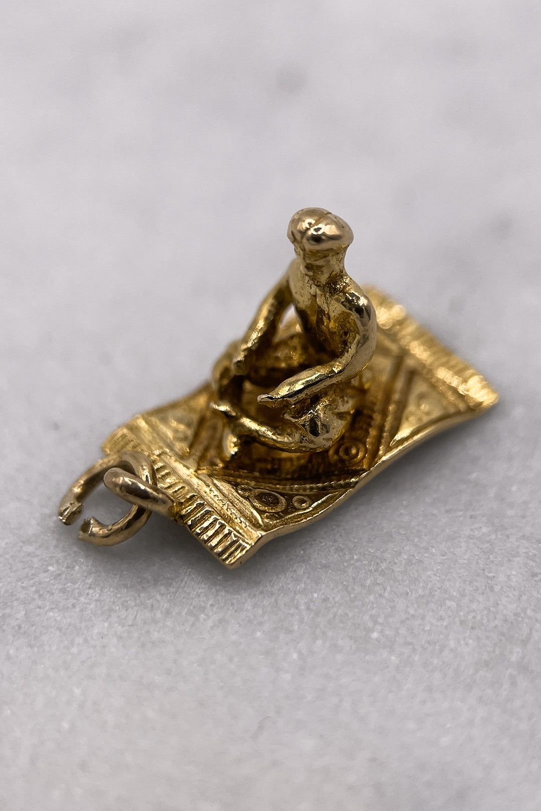The Fairytale Aladdin on the Magical Carpet Charm (375 9ct gold, made in 1958)