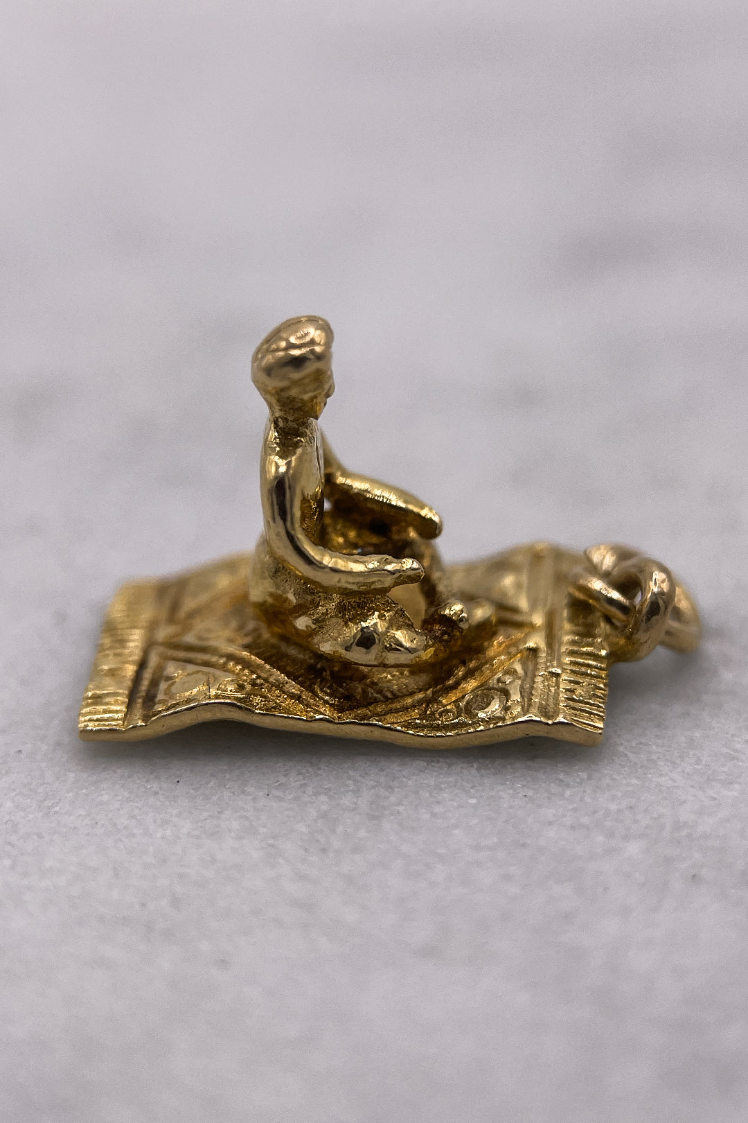 The Fairytale Aladdin on the Magical Carpet Charm (375 9ct gold, made in 1958)