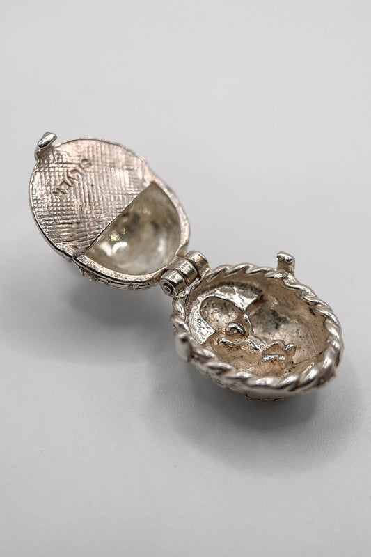 The Opening Baby In a Cradle charm (925 Sterling Silver made c 1950s - 1970s)