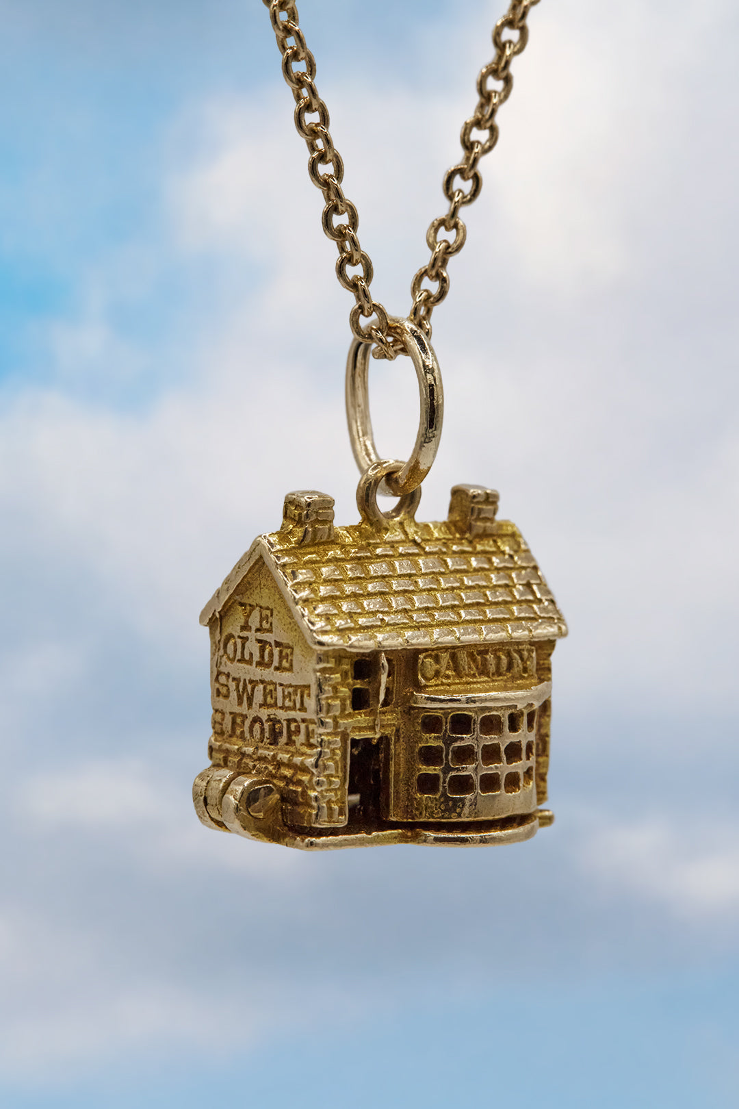 The Village British Sweet Shop Opening Charm  (375 9ct gold, made in the 1960s)