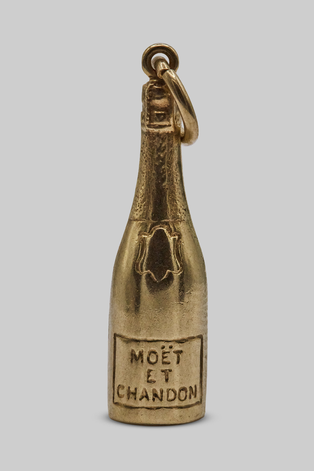 The Dazzling Golden Moët Et Chandon Bottle charm (9ct 375 Gold, made in 1951)