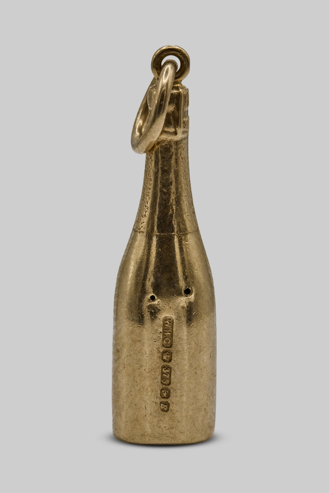 The Dazzling Golden Moët Et Chandon Bottle charm (9ct 375 Gold, made in 1951)
