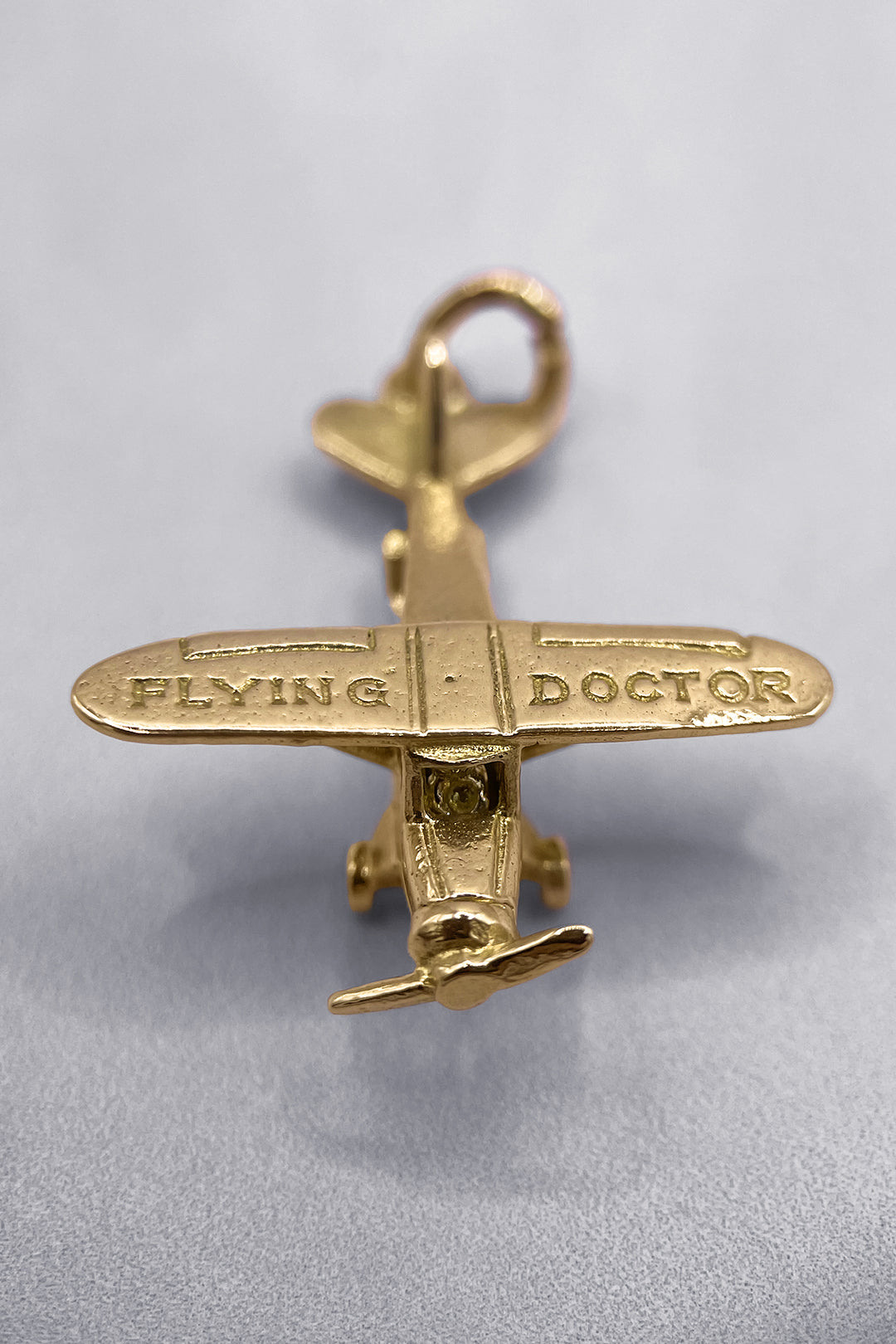 The International Secret Flying Doctor of the World for Safe Travels Vintage Charm (375 9ct gold, made in 1965)