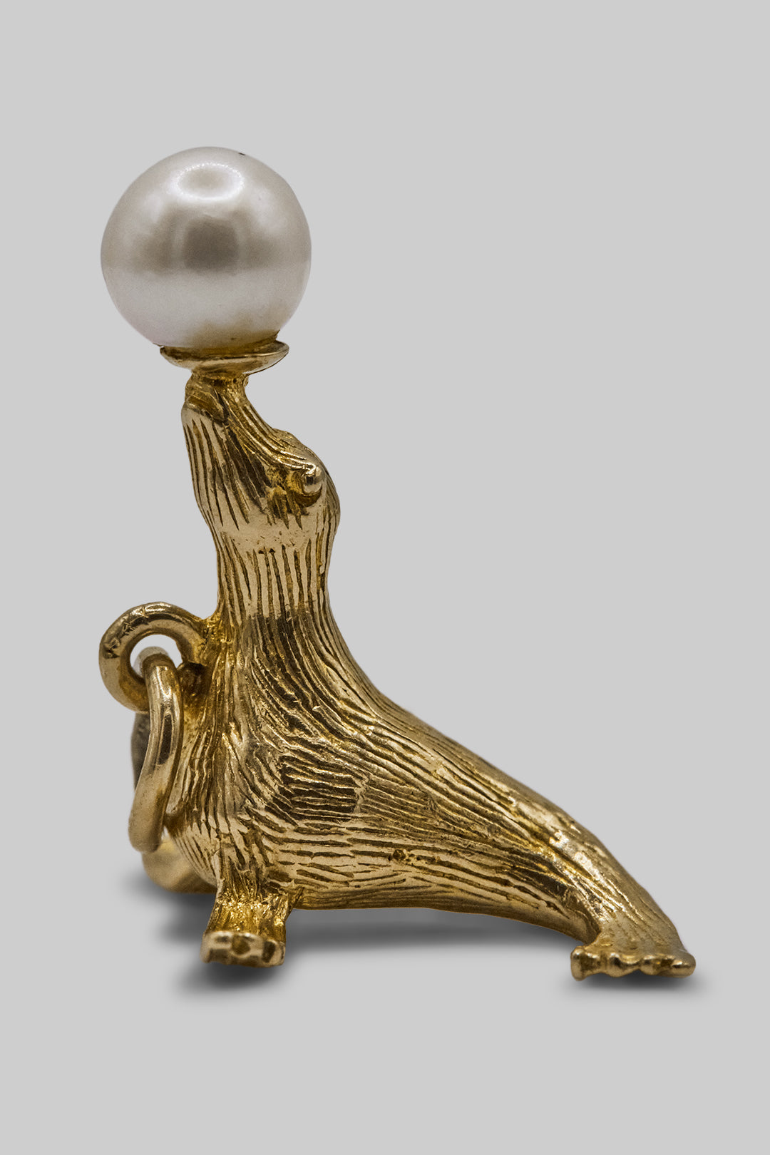 The Pearl Balancing Seal Charm (375 9ct gold, made in 1967)