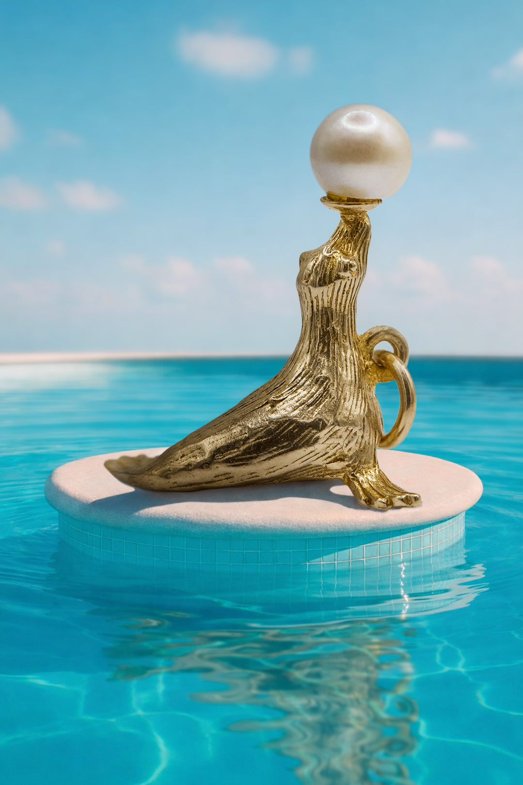 The Pearl Balancing Seal Charm (375 9ct gold, made in 1967)