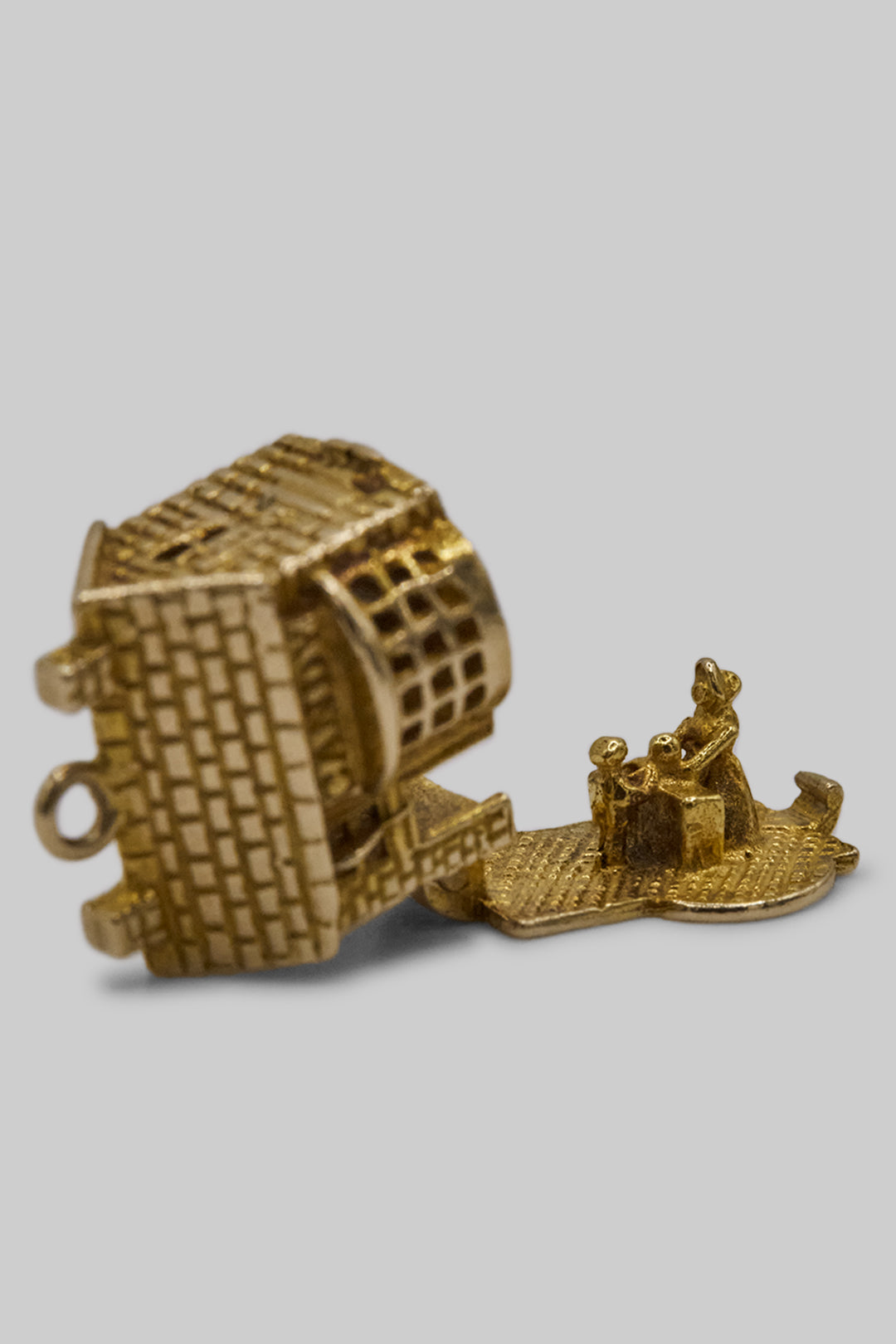 The Village British Sweet Shop Opening Charm  (375 9ct gold, made in the 1960s)