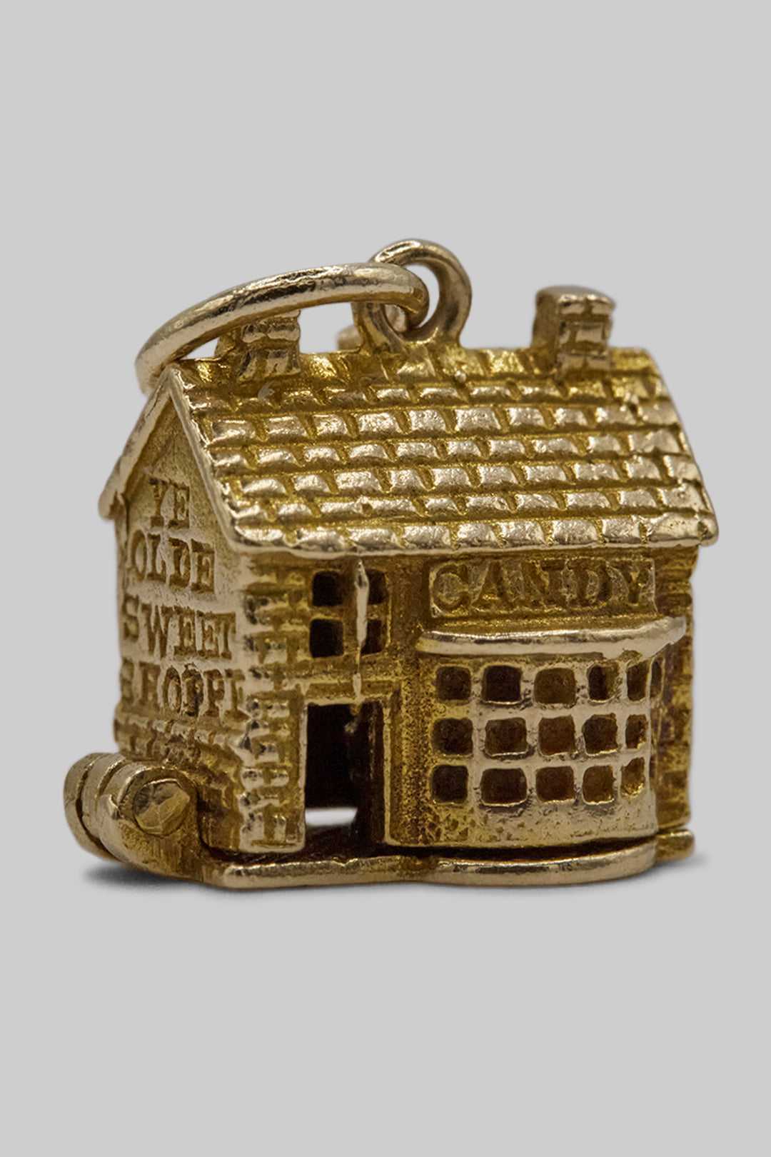 The Village British Sweet Shop Opening Charm  (375 9ct gold, made in the 1960s)