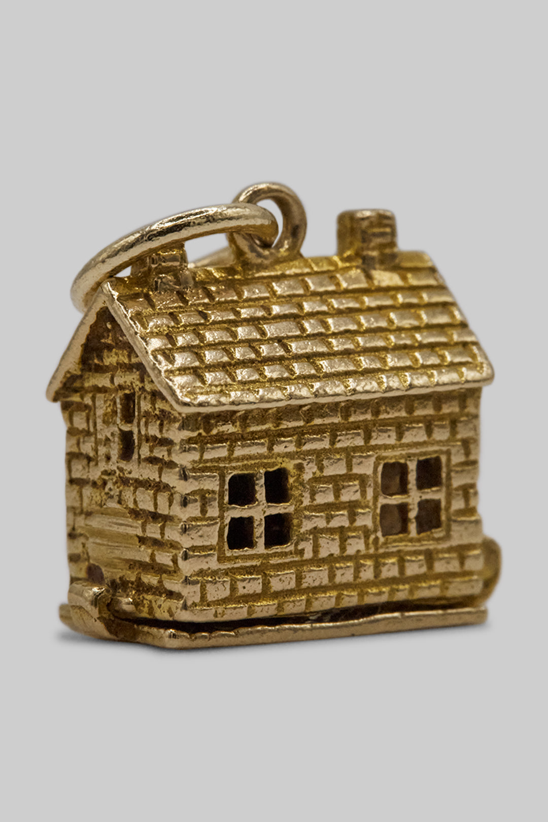 The Village British Sweet Shop Opening Charm  (375 9ct gold, made in the 1960s)