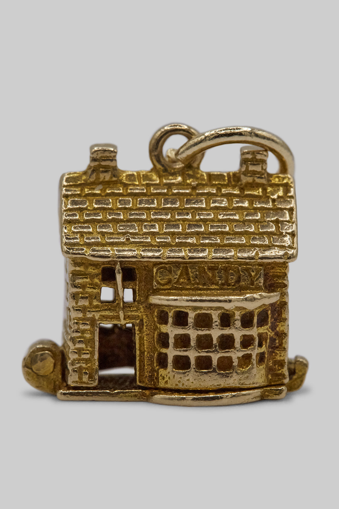 The Village British Sweet Shop Opening Charm  (375 9ct gold, made in the 1960s)